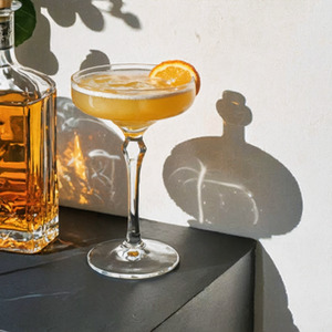 An image of the Arsenic & Old Lace cocktail submitted by Toby that contains London Dry Gin, Dry Vermouth, Crème de Violette, Absinthe and Orange