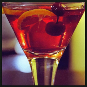 An image of the Bijou cocktail submitted by Toby that contains London Dry Gin, Sweet Vermouth, Green Chartreuse, Orange Bitters, Lemon and Cocktail Cherry