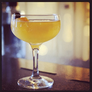 An Instagram of the Boothonia cocktail submitted by Toby that contains London Dry Gin, Dry Vermouth, Amer Picon, Passion Fruit Juice, Lemon and Cocktail Onion