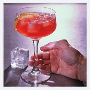 An image of the Campari Swizzle cocktail submitted by Toby that contains Turin Bitters, Agricole Rhum, Falernum, Sweet Vermouth, Lemon and Lemon