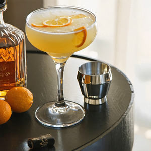 An Instagram of the Deep Blue Sea cocktail submitted by Toby that contains London Dry Gin, Quinquina, Crème de Violette and Orange