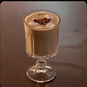 An image of the Eggnog cocktail submitted by Toby that contains Cognac, Gold Rum, Milk, Egg, Simple Syrup and Nutmeg