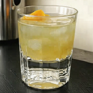 An image of the Flannel Shirt cocktail submitted by Toby that contains Blended Scotch, Apple Juice, Averna, Lemon, Demerara Syrup, Allspice Dram, Angostura Bitters and Orange