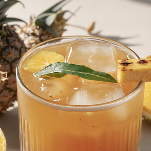 An image of the Ginger Smash, Summer cocktail submitted by Toby that contains Fresh Ginger, Pineapple, Caster Sugar, Agricole Rhum, Lime, Maraschino Liqueur, Apple Schnapps and Pineapple