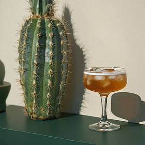 An image of the Hotel D'Alsace cocktail submitted by Toby that contains Irish Whiskey, Curaçao Triple Sec, Benedictine DOM and Rosemary