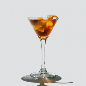 An image of the Lucien Gaudin Cocktail cocktail submitted by Toby that contains London Dry Gin, Curaçao Triple Sec, Turin Bitters, Dry Vermouth and Orange