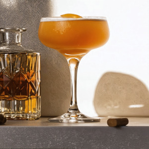 An Instagram of the Nude Eel cocktail submitted by Toby that contains London Dry Gin, Cognac, Dubonnet Rouge and Green Chartreuse