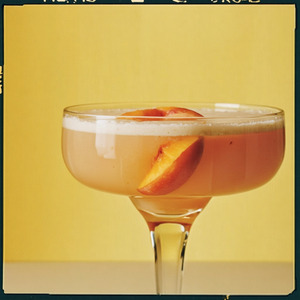 An image of the Peach Daiquiri cocktail submitted by Toby that contains Lime, Rum, Agave Syrup and Peach Purée