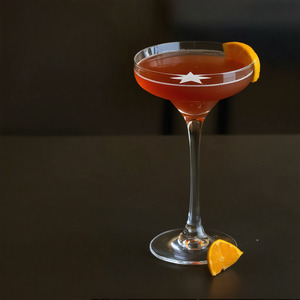 An image of the Porn Star Martini cocktail submitted by Toby that contains Passion Fruit, Vanilla Vodka, Vanilla Syrup, Lime and Passoa