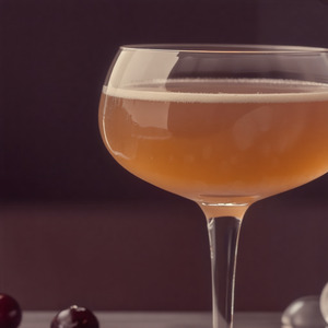 An image of the Reaulais cocktail submitted by Toby that contains Pineau des Charentes, Cognac, Pineapple Juice, Grenadine and Sparkling Wine