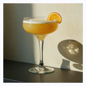 An image of the Smoked Scotch Sour cocktail submitted by Toby that contains Blended Scotch, Amaro Meletti, Lapsong Souchang Syrup, Egg, Orange, Lemon, Xocolatl Mole Bitters and Orange