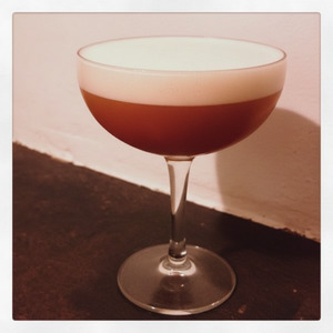 An image of the Amaretto Bitter cocktail submitted by Toby that contains Lemon, Amaretto, Smith & Cross, Aperol, Rich Simple Syrup (2:1) and Egg
