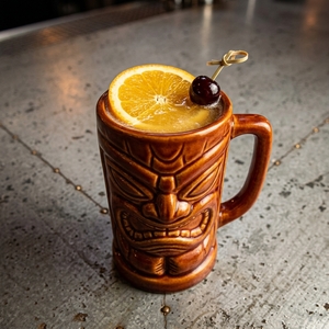 An image of the Beach Bum cocktail submitted by Toby that contains Gold Rum, White Rum, Pineapple Juice, Lime, Apricot Brandy, Orgeat Syrup, Orange and Cocktail Cherry