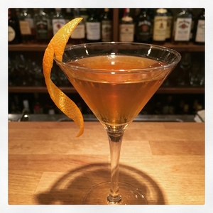 An image of the Beauregarde cocktail submitted by Toby that contains Dry Vermouth, London Dry Gin, Blueberry Shrub, Maraschino Liqueur, Orange Bitters, Peychauds Bitters and Orange