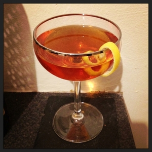 An image of the Belle Star cocktail submitted by Toby that contains Bourbon, Apple Brandy, Suze, Strega, Orange Bitters and Lemon