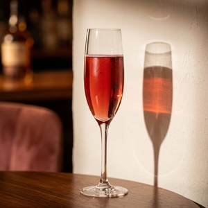 An image of the Bellini cocktail submitted by Toby that contains Peach Purée, Prosecco and Peach Schnapps
