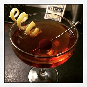 An image of the Bijou cocktail submitted by Toby that contains London Dry Gin, Sweet Vermouth, Green Chartreuse, Orange Bitters, Lemon and Cocktail Cherry