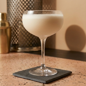 An image of the Blue Berry Cheesecake Martini cocktail submitted by Toby that contains Vanilla Vodka, Cream, Coffee Liqueur, Crème de Fraise and Blueberry Preserve