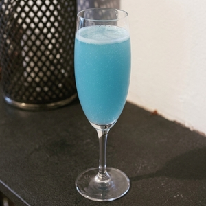 An image of the Blueberry-Pineapple Champagne Sparklers cocktail submitted by Toby that contains Blueberries, Pineapple Juice, Mint, Caster Sugar and Champagne