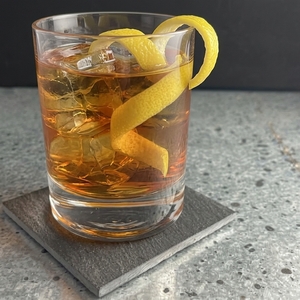 An image of the Br'er Rabbit cocktail submitted by Toby that contains Rye Whiskey, Crème de Cassis, Suze, Absinthe and Lemon