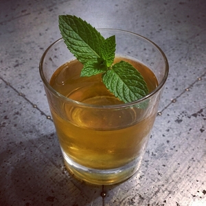 An image of the Brugal Rum Punch cocktail submitted by Toby that contains Gold Rum, Lime, Angostura Bitters, Grenadine, Mint, Caster Sugar, Cocktail Cherry and Ginger Ale