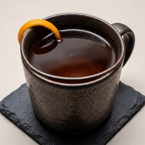 An image of the Chai Toddy cocktail submitted by Toby that contains Spiced Rum, Black Tea, Honey and Mint Bitters