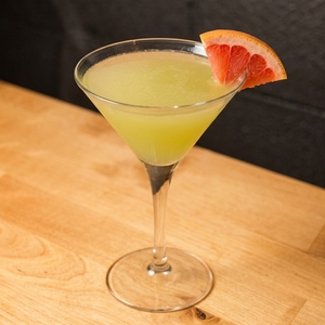 An image of the Chick'n'Sours Hikaru Sour cocktail submitted by Toby that contains Orange, Plain Vodka, Lemon, Green Tea Syrup, Egg, Crème de Cacao Blanc and Pink Grapefruit