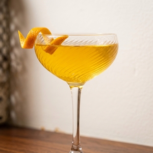 An image of the Chingon cocktail submitted by Toby that contains Reposado Tequila, Benedictine DOM, Orange, Lime, Orgeat Syrup and Orange