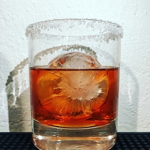 An image of the Copper Canyon cocktail submitted by Toby that contains Reposado Tequila, Crème de Cacao Blanc, Suze, Lemon, Hot Sauce and Salt