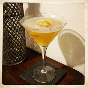 An image of the Cosmopolitan cocktail submitted by Toby that contains Lemon Vodka, Curaçao Triple Sec, Lime, Cranberry Juice, Simple Syrup and Orange