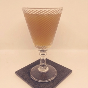 An image of the Cuban Mahatten cocktail submitted by Toby that contains White Rum, Sweet Vermouth and Angostura Bitters