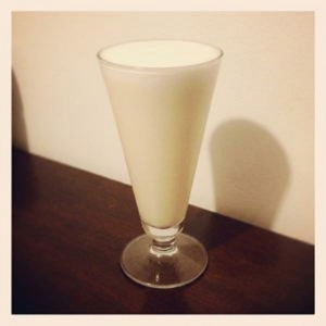An image of the Dark and Stormy Shandy cocktail submitted by Toby that contains Brown Butter Washed Rum, Ginger Syrup, Lime, Beer and Dark Rum