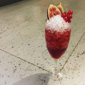 An image of the Diamond Daisy Shim cocktail submitted by Toby that contains London Dry Gin, Grenadine, Lemon, Lime, Sugar, Champagne and Fruit