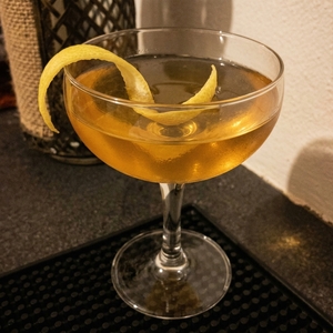 An image of the Donizetti cocktail submitted by Toby that contains London Dry Gin, Amaro Ciociaro Liqueur, Apricot Brandy, Champagne and Lemon