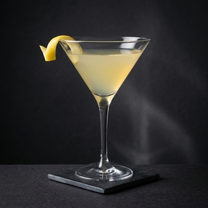 An image of the Dry County cocktail submitted by Toby that contains Bourbon, Dry Vermouth, Ginger Liqueur, Lemon Bitters and Lemon