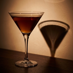 An image of the Eastern Sin cocktail submitted by Toby that contains Blended Scotch, Cherry Brandy, Curaçao Triple Sec, Sweet Vermouth and Pineapple