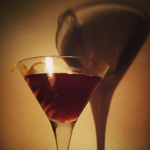 An image of the Fall Back cocktail submitted by n0tquitethere that contains Rye Whiskey, Apple Brandy, Amaro Nonino, Sweet Vermouth, Peychauds Bitters and Orange