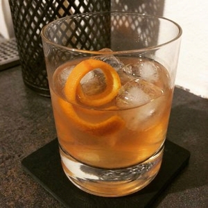 An image of the Flannel Shirt cocktail submitted by Toby that contains Blended Scotch, Apple Juice, Averna, Lemon, Demerara Syrup, Allspice Dram, Angostura Bitters and Orange