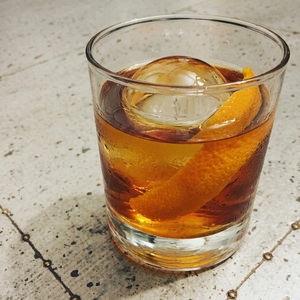 An image of the Four Forte cocktail submitted by Toby that contains Agricole Rhum, Old Monk Rum, Smith & Cross, Goslings Black Seal 151, Angostura Bitters, Orange Bitters, Whiskey Barrel Aged Bitters and Xocolatl Mole Bitters and Demerara SugarOrange