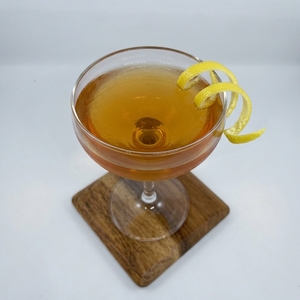 An image of the Gilchrist cocktail submitted by Toby that contains Blended Scotch, Pear Brandy, Grapefruit, Averna, Grapefruit Bitters and Lemon