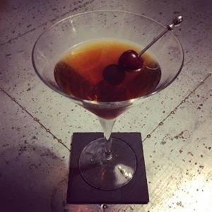 An image of the Harry Palmer cocktail submitted by Toby that contains Rye Whiskey, Sweet Vermouth, Suze and Cocktail Cherry