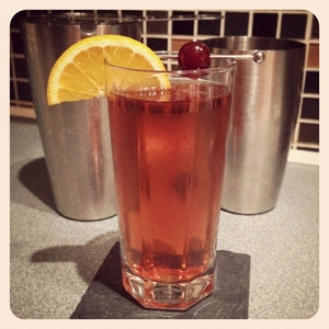 An image of the Harvest Sling cocktail submitted by Toby that contains Apple Brandy, Sweet Vermouth, Benedictine DOM, Cherry Brandy, Lemon, Ginger Beer, Cocktail Cherry and Orange