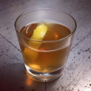An image of the Island Old Fashioned cocktail submitted by Toby that contains Gold Rum, Falernum, Sugar Cane Syrup, Angostura Bitters and Lemon