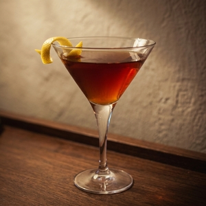 An image of the Italian Stallion cocktail submitted by Toby that contains Bourbon, Turin Bitters, Sweet Vermouth, Angostura Bitters and Lemon
