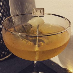 An image of the Jolley Pilot cocktail submitted by n0tquitethere that contains Amontillado Sherry, London Dry Gin, Curaçao Triple Sec, Cognac, Angostura Bitters, Lemon and Cocktail Onion