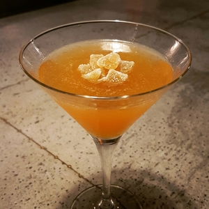 An image of the Kentucky Longshot cocktail submitted by Toby that contains Bourbon, Ginger Liqueur, Crème de Pêche, Angostura Bitters, Peychauds Bitters and Crystallised Ginger