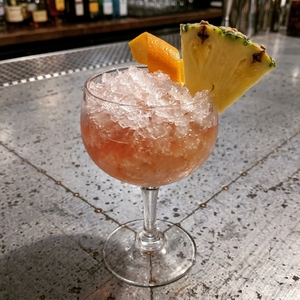 An image of the Knickerbocker á la Monsieur cocktail submitted by Toby that contains Gold Rum, Curaçao Triple Sec, Raspberry Syrup, Lemon, Orange and Pineapple