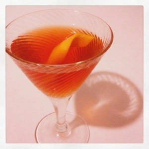 An image of the L'année du Mexique cocktail submitted by Toby that contains Reposado Tequila, Amontillado Sherry, Suze, Crème de Mûre, Orange Bitters and Orange