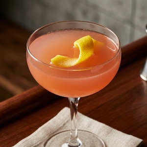 An image of the Leg Before Wicket cocktail submitted by Toby that contains London Dry Gin, Dubonnet Rouge, Lime, Turin Bitters and Lemon