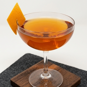An image of the Lucien Gaudin Cocktail cocktail submitted by Toby that contains London Dry Gin, Curaçao Triple Sec, Turin Bitters, Dry Vermouth and Orange
